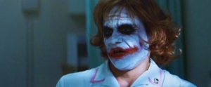The Dark Knight: Harvey Dent (Aaron Eckhart), Joker (Heath Ledger) et Rachel Dawes (Maggie Gyllenhaal)